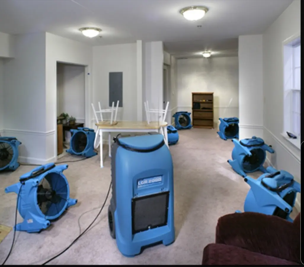 Air movers and dehumidifier setup for Water Damage Restoration in Madisonville